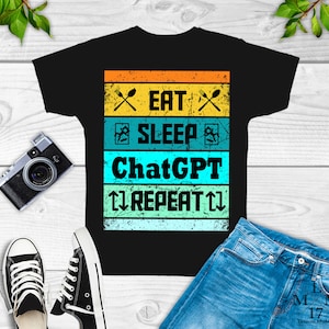 May include: Black t-shirt with a vintage-style graphic that reads "Eat, Sleep, ChatGPT, Repeat". The graphic is in a rainbow color scheme with a distressed look.