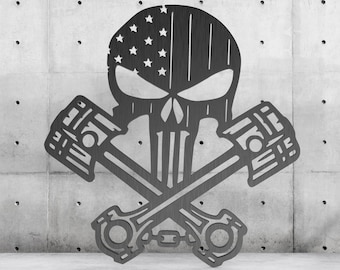 May include: A metal wall art sculpture featuring a skull with an American flag design and two crossed pistons.
