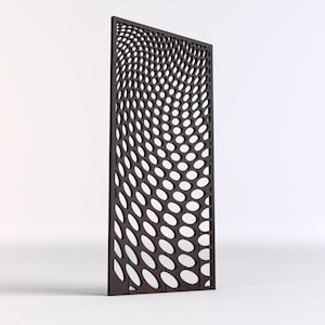 May include: A dark brown wooden room divider with a geometric pattern of oval cutouts. The pattern creates a wave-like effect.
