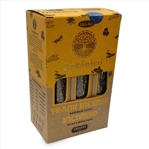 May include: A cardboard box of Frank Incense handmade sticks. The box is tan and yellow with the word "Org&aacute;nico" and a tree logo. The text "FRANK INCENSE" and "INCIENSO" are printed on the front. The box contains several incense sticks.