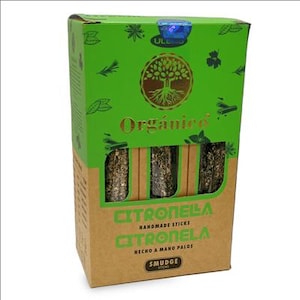 May include: A box of Citronella handmade sticks. The box is green and brown with the word "Organico" in gold lettering. The box has a tree logo and the words "Citronella" and "Smudge Sticks" printed on it.