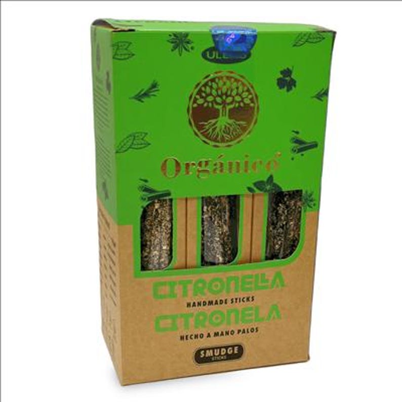 May include: A box of Citronella handmade sticks. The box is green and brown with the word "Organico" in gold lettering. The box has a tree logo and the words "Citronella" and "Smudge Sticks" printed on it.
