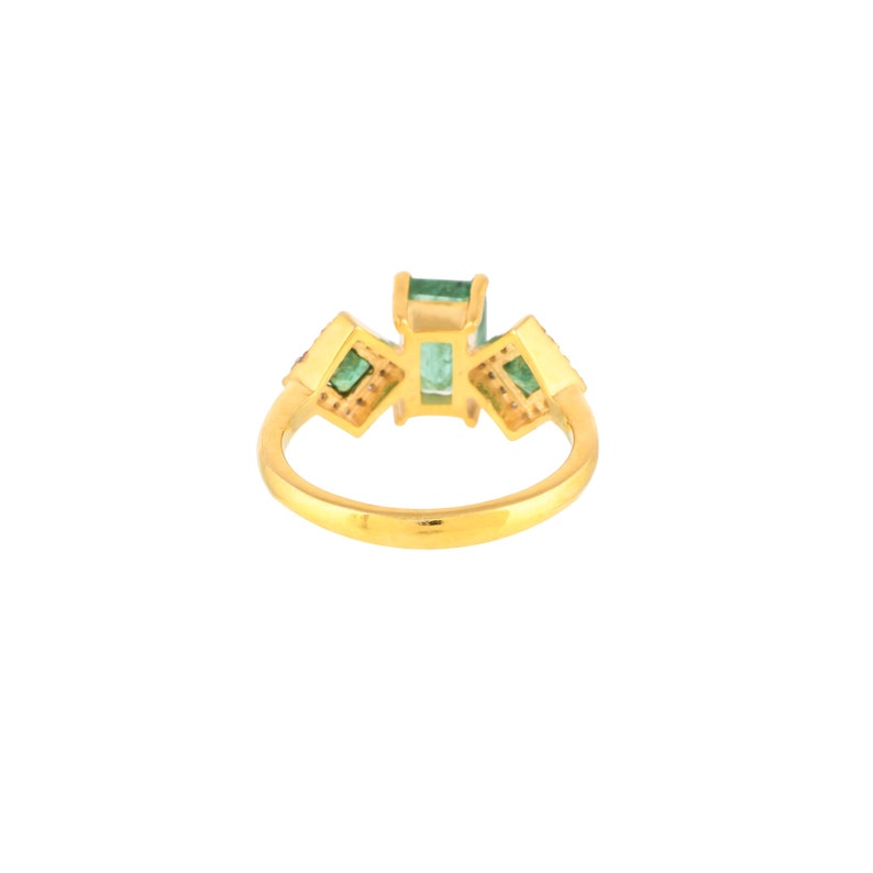 Back view of ring on white background, showing band construction