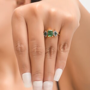 Top view of ring worn, highlighting oxidized diamond halo framing