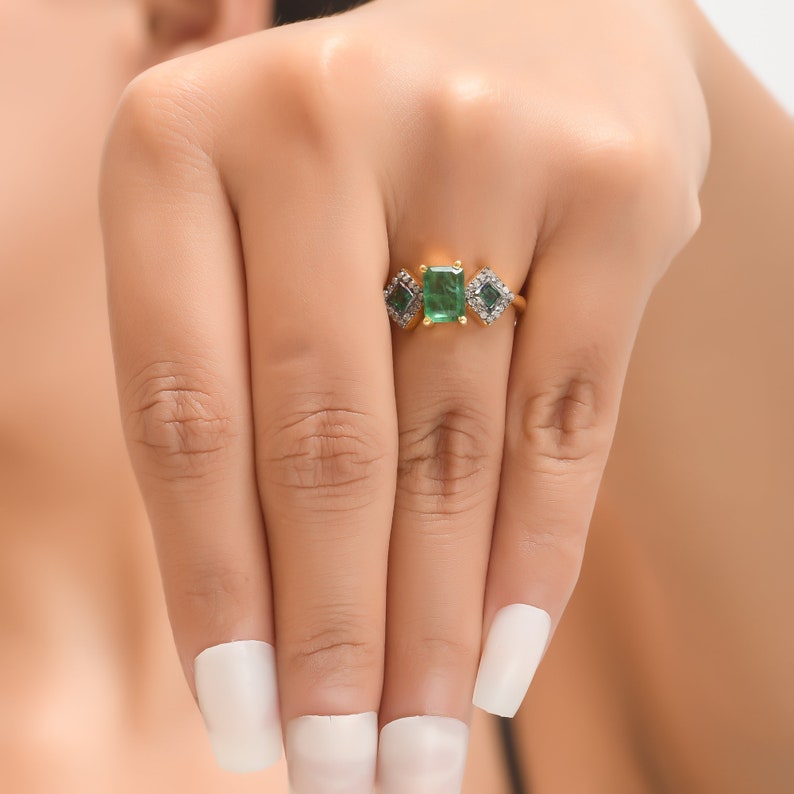 Top view of ring worn, highlighting oxidized diamond halo framing