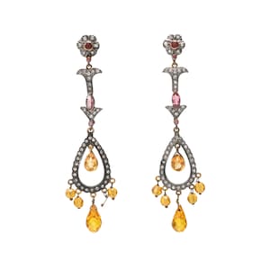 May include: A pair of silver and gold dangle earrings with pink and yellow gemstones. The earrings feature a teardrop design with a smaller teardrop hanging from the bottom.