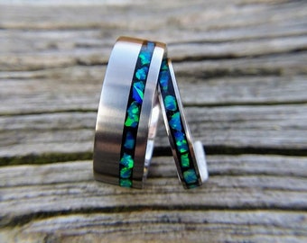 Titanium Wedding Band Set with Pacific Blue Opal inlay in Black Crushed Stone Background. 7 mm Offset Inlay and 3 mm widths, Opal Ring Set