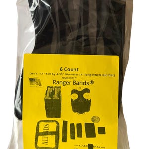 May include: A pack of six black Ranger Bands, made of EPDM rubber. The yellow label states the dimensions: 3.8 cm tall, 11.0 cm diameter, and 17.8 cm long when laid flat. The package is sealed in a clear plastic bag.