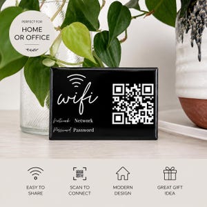 May include: A rectangular black sign featuring a white Wi-Fi symbol, the word wifi in script, a QR code, and the labels Network and Password. The sign includes text stating PERFECT FOR HOME OR OFFICE, EASY TO SHARE, SCAN TO CONNECT, MODERN DESIGN, and GREAT GIFT IDEA.
