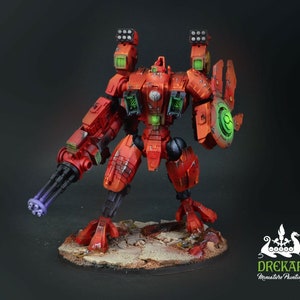 May include: A detailed miniature of a red and orange mech warrior with a large gun and shield. The model has green and black accents, and is posed on a textured base. The miniature is labeled "DREKAR Miniature Painting."