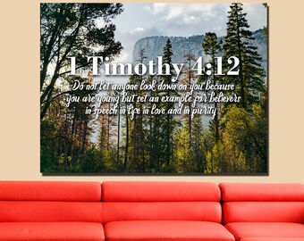 May include: A canvas print with a forest scene and the Bible verse 1 Timothy 4:12, which reads "Do not let anyone look down on you because you are young but set an example for believers in speech in life in love and in purity."