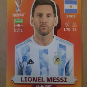Panini WM 2022 Katar LIONEL MESSI Argentinien WM Katar 2022 Panini #19 Arg Orange Version Mint/Near Mint - Last World Cup