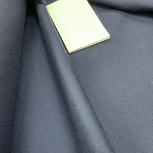 Blue Marine dark  blue colour fine thin drape  of excellent quality for a  suit or light coat Fabric.  Wool by Yard