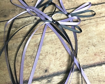 25 Dusk purple/black bows.  Dusk bows.