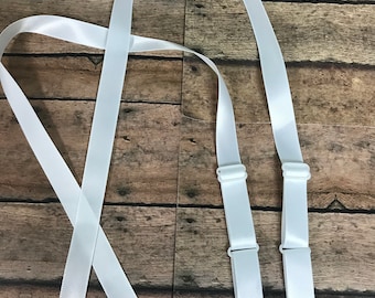 6 pair of 3/8” white satin adjustable straps.  Slip straps.