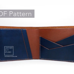 May include: Open brown and blue leather wallet with multiple card slots and a billfold. The wallet has a logo that reads "Leather D/Y Studio" and the website "leatherdiystudio.com".
