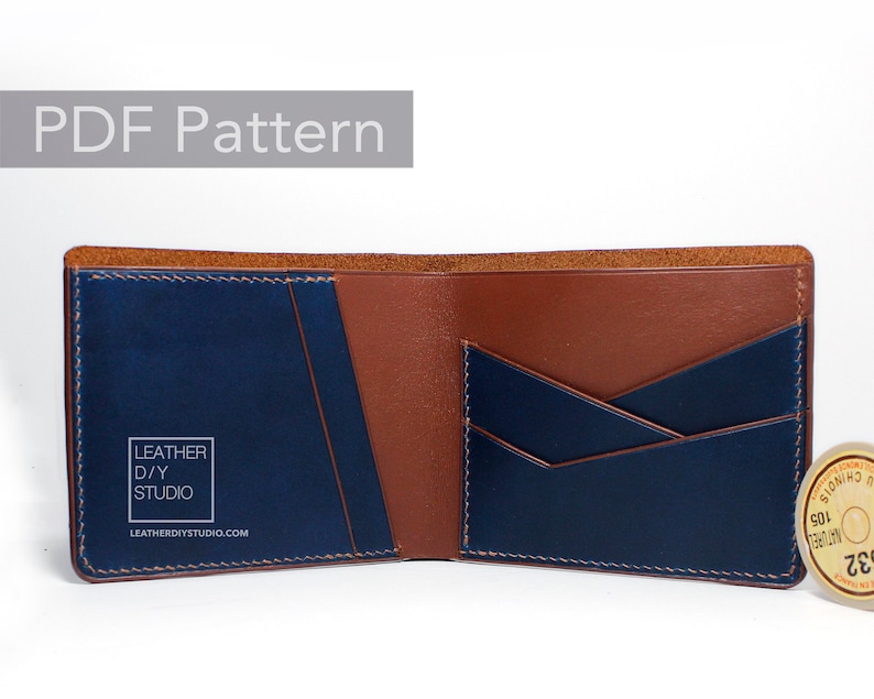 May include: Open brown and blue leather wallet with multiple card slots and a billfold. The wallet has a logo that reads "Leather D/Y Studio" and the website "leatherdiystudio.com".