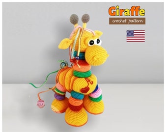 May include: A handmade, colorful crochet giraffe toy. The giraffe is primarily yellow with rainbow-colored accents and a red heart. The image includes the text "Giraffe crochet pattern" and a US flag.