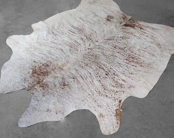 Brun exotisk kohudmatta, storlek 7,1x6,9' - faktisk bild