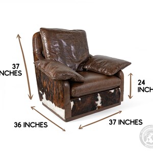 May include: Brown leather armchair with a cowhide pattern on the base. The chair measures 37 inches tall, 36 inches wide, and 37 inches deep.