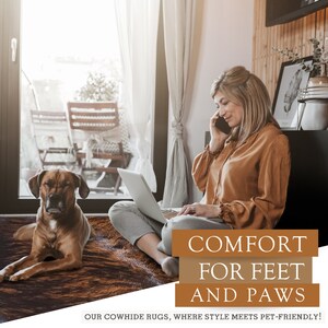 May include: A brown and white cowhide rug with a woman sitting on it using a laptop and talking on a cell phone. A brown dog is lying on the rug. The text on the image reads "Comfort for Feet and Paws. Our Cowhide Rugs, Where Style Meets Pet-Friendly!"