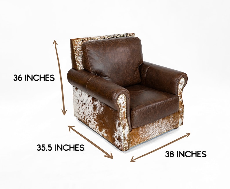May include: Brown leather armchair with a cowhide pattern on the bottom and sides. The chair is 36 inches tall, 35.5 inches wide, and 38 inches deep.