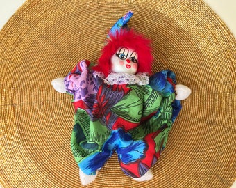 small porcelain clown dolls
