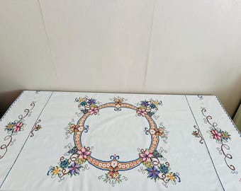 Vintage hand embroidered tablecloth with flowers