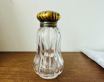 Vintage glass sugar shaker with brass metal screw top
