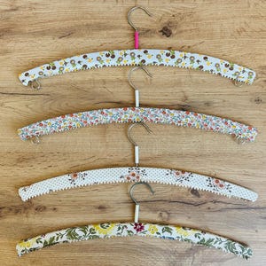 Vintage set of 4 vinyl cloth hangers -Vintage set of 4 wooden clothes hangers with vinyl over - Colorful coating hangers