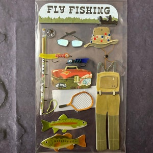 May include: Fly fishing themed sticker sheet. Includes a fishing rod, reel, sunglasses, hat, lures, tackle box, net, waders, and two fish. The text "FLY FISHING" is at the top of the sheet.