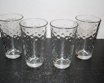 May include: Set of four clear glass tumblers with a textured bubble design.