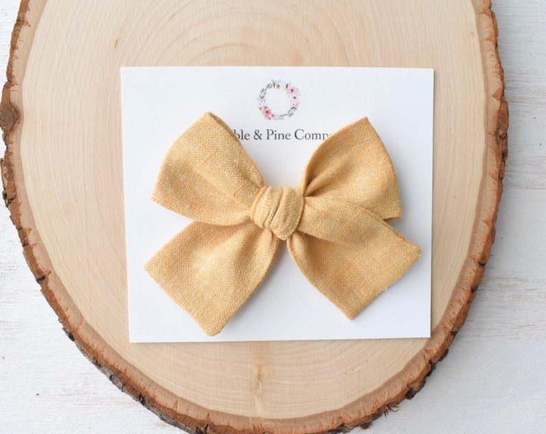 mustard baby bow