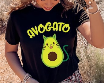 May include: A black t-shirt with a graphic of a green avocado with a cat face and the text "AVOGATO" in yellow letters.