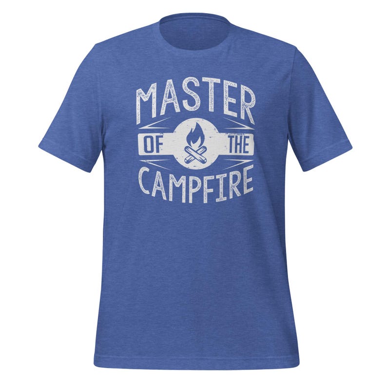 May include: A heathered blue short-sleeve t-shirt featuring a white distressed graphic print on the chest. The design includes a central campfire icon inside a circle, flanked by the text "MASTER" above and "OF THE CAMPFIRE" below.