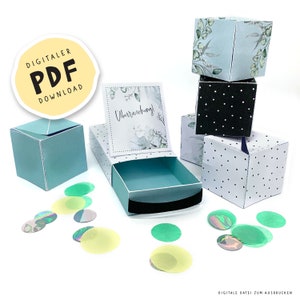 Könnte beinhalten: Eine Sammlung dekorativer Papierboxen in verschiedenen Designs. Einige Boxen sind hellblau, andere weiß mit schwarzen Punkten, und eine ist schwarz mit weißen Punkten. Die Boxen sind geöffnet und geschlossen, mit Konfetti darum verstreut. Der Text "DIGITALER PDF DOWNLOAD" ist enthalten.