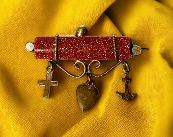 Edwardian brooch  with goldstone and charms