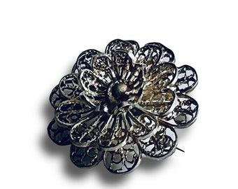 Vintage filigree flower brooch made in silver