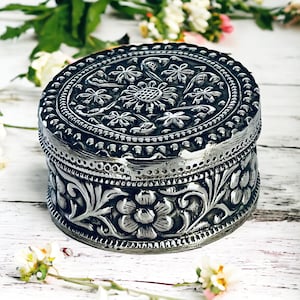 Vintage silver box with embossed floral decoration