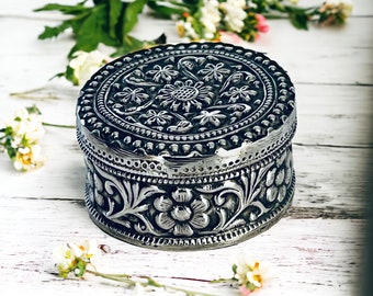 Vintage silver box with embossed floral decoration