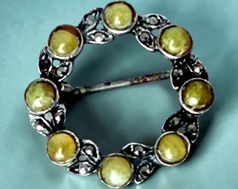 Little brooch made in Sterling silver and stones