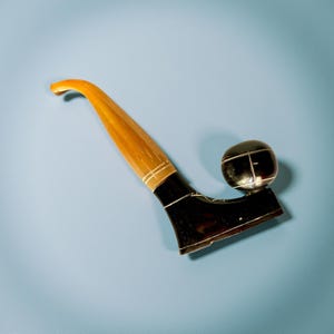 Vintage pipe in the shape of a boot and a ball made in horn.