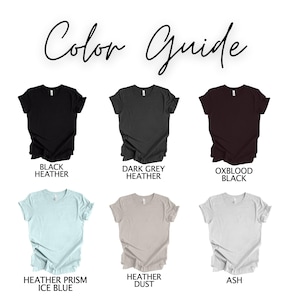 May include: Color guide for t-shirts showing different colors: black heather, dark grey heather, oxblood black, heather prism ice blue, heather dust, and ash.