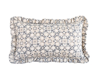 May include: A rectangular throw pillow featuring a repeating geometric and floral pattern in shades of charcoal gray and beige. The pillow is finished with a gathered fabric ruffle trim that extends around all four edges of the rectangular cushion.