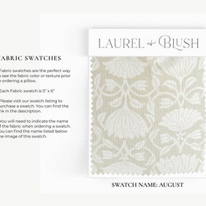 May include: A fabric swatch sample from Laurel & Blush in the color August. The swatch features a white floral pattern on a beige linen background. The swatch measures 5 inches by 6 inches.