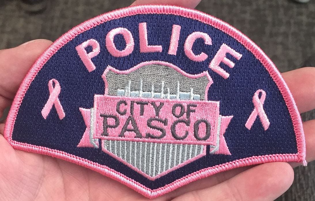 Pasco Police - The 2018 Patch Board displaying all of the agencies from  around the world; who are also displaying a Pasco Pink Patch