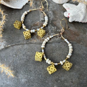 Stylish Boho beaded hoop earrings .