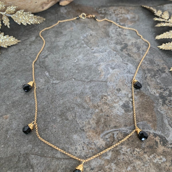 Sleek gemstone choker necklace .