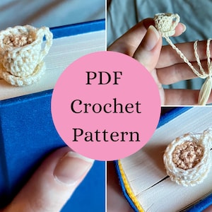 May include: A crochet bookmark featuring a miniature cream-colored teacup with a light brown center, attached to a long thin cord with a tassel. The text PDF Crochet Pattern is displayed in the center of the image over a blue book.