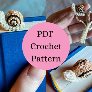 May include: A crochet snail bookmark featuring a cream-colored body and a tan shell with dark brown spiral detailing. The snail is attached to a thin cream-colored cord with a small tassel at the end. The text PDF Crochet Pattern is visible.